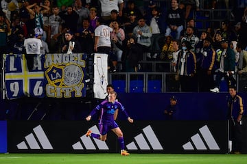 LA Galaxy fans look on as Karol Swiderski celebrates Charlotte's winner.