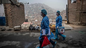 (FILES) In this file photo taken on April 28, 2021 Health workers arrive to inoculate elderly citizens with doses of the Pfizer-BioNTech vaccine against COVID-19, at their house at El Agustino district in Lima. - The COVID-19 coronavirus has claimed more than one million lives in Latin America and the Caribbean, where vaccination is proceeding too slowly to halt the pandemic, unlike in places like the United States and Europe, which are already seeing a way out of the crisis. (Photo by ERNESTO BENAVIDES / AFP)