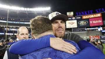 New York (United States), 31/10/2024.- Los Angeles Dodgers Freddie Freeman (R) embraces a member of the Dodger team after defeating the New York Yankees during game five to win the Major League Baseball (MLB) World Series at Yankees Stadium in the Bronx borough of New York, New York, USA, 30 October 2024. (Nueva York) EFE/EPA/CJ GUNTHER