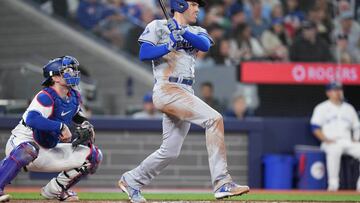 Apr 26, 2024; Toronto, Ontario, CAN; Los Angeles Dodgers first base Freddie Freeman (5) hits an RBI single against the Toronto Blue Jays during the third inning at Rogers Centre. Mandatory Credit: Nick Turchiaro-USA TODAY Sports