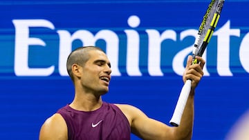 Aug 25, 2025; Flushing, NY, USA; Carlos Alcaraz of Spain in action against Reilly Opelka of the United States in the first round of the men’s singles at the US Open at Arthur Ashe Stadium in Billie Jean King National Tennis Centre. Mandatory Credit: Mike Frey-Imagn Images