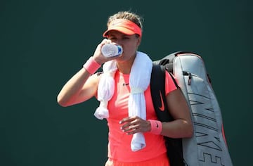 Eugenie Bouchard walks off court after losing in the final qualifying round against Sweden's Rebecca Peterson in the Miami Open.