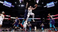 CHARLOTTE, NORTH CAROLINA - DECEMBER 23: Christian Braun #0 of the Denver Nuggets lays the ball up during the second half of an NBA game at Spectrum Center on December 23, 2023 in Charlotte, North Carolina.