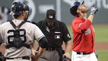 Boston Red Sox's J.D. Martinez celebrates his two-run homer in front of New York Yankees catcher Austin Romine (28) in the first inning of a baseball game at Fenway Park, Friday, July 26, 2019, in Boston. (AP Photo/Elise Amendola)