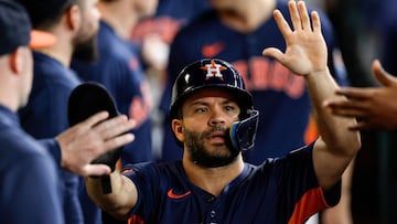 HOUSTON, TEXAS - SEPTEMBER 22: Jose Altuve #27 of the Houston Astros is congratulated by teammates in the dugout after scoring a run in the third inning against the Los Angeles Angels at Minute Maid Park on September 22, 2024 in Houston, Texas. Tim Warner/Getty Images/AFP (Photo by Tim Warner / GETTY IMAGES NORTH AMERICA / Getty Images via AFP)