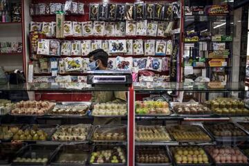 Sweets are seen displayed in a shop in the multi cultural district of Fordsburg, Johannesburg, on May 23, 2020 ahead of the Muslim feat of the Eid al Fitr that marks the end of the Holy Month of Ramadan.