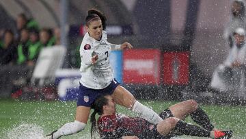 SAN DIEGO, CALIFORNIA - MARCH 06: Alex Morgan #7 of the United States and Vanessa Gilles #14 of Canada collide in the first half during the 2024 Concacaf W Gold Cup semifinals at Snapdragon Stadium on March 06, 2024 in San Diego, California.   Sean M. Haffey/Getty Images/AFP (Photo by Sean M. Haffey / GETTY IMAGES NORTH AMERICA / Getty Images via AFP)