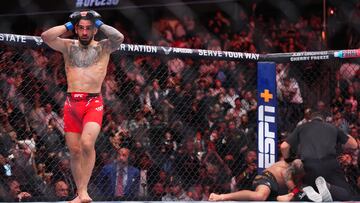 ANAHEIM, CALIFORNIA - FEBRUARY 17: Ilia Topuria of Germany celebrates after his knockout victory against Alexander Volkanovski of Australia in the UFC featherweight championship fight during the UFC 298 event at Honda Center on February 17, 2024 in Anaheim, California. (Photo by Cooper Neill/Zuffa LLC via Getty Images)