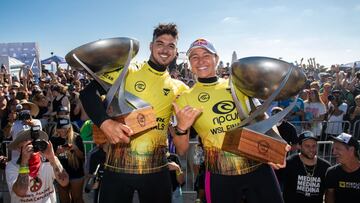 SAN CLEMENTE, CALIFORNIA, USA - SEPTEMBER 14: Four-time WSL Champion Carissa Moore of Hawaii and two-time WSL Champion Gabriel Medina of Brazil after surfing in the Title Match of the Rip Curl WSL Finals on September 14, 2021 at Lower Trestles, San Clemen