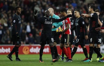 Liverpool's Sadio Mane looks dejected after conceding the second penalty