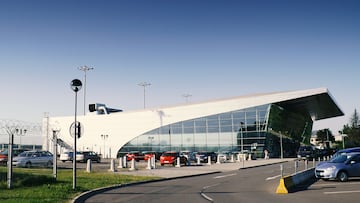 Ostrava Airport (Official whole title is Leoš Janáček Ostrava Airport) building with surrounding parking lot during summer season. Airport name was given by Czech famouse classic music composer Leoš Janáček (July 3, 1854 – August 12, 1928) who was born in near village Hukvaldy and during his life became immortal symbol of the Moravian-Silesian Region.