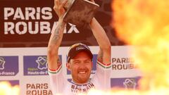 FILE PHOTO: Cycling - Paris-Roubaix - Roubaix, France October 3, 2021  Italy's Sonny Colbrelli celebrates on the podium after winning the race REUTERS/Yves Herman/File Photo