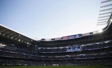 Real Madrid and Espanyol players stand during a minute of silence for the victims following a shooting by gunmen at the offices of the satirical weekly newspaper Charlie Hebdo, before their Spanish first division soccer match at Santiago Bernabeu stadium 