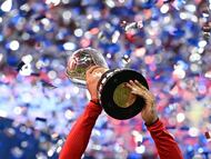 Toluca's forward #09 Alexis Vega lifts the trophy after winning the Liga MX Apertura final second leg football match between Toluca and Tigres at the Nemesio Diez stadium in Toluca, Mexico on December 14, 2025. (Photo by Yuri CORTEZ / AFP)