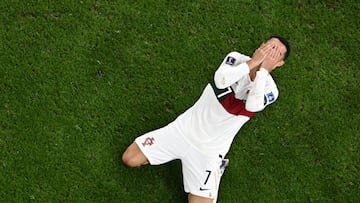 Portugal's forward #07 Cristiano Ronaldo reacts during the Qatar 2022 World Cup quarter-final football match between Morocco and Portugal at the Al-Thumama Stadium in Doha on December 10, 2022. (Photo by MANAN VATSYAYANA / AFP)