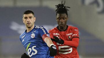 Rennes' French midfielder Eduardo Camavinga (R) fights for the ball with Strasbourg's Serbian defender Stefan Mitrovic during the French L1 football match between Strasbourg (RCSA) and Stade Rennais (SR) at the Meinau stadium in Strasbourg, east