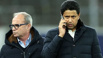 Paris Saint Germain's Qatari president Nasser al-Khelaifi (R) speaks on the telephon to Paris Saint Germain's Portuguese Football Advisor Luis Campos during a training session on the eve of the UEFA Champions League football match against Stuttgart on January 28, 2025 at the Stuttgart Arena in Stuttgart. (Photo by FRANCK FIFE / AFP)