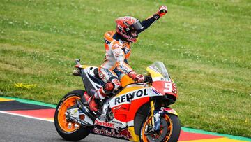 Spanish Honda rider Marc Marquez celebrates winning the MotoGP competition of the Moto Grand Prix of Germany at the Sachsenring Circuit on July 2, 2017 in Hohenstein-Ernstthal, eastern Germany. / AFP PHOTO / ROBERT MICHAEL