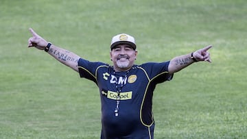 (FILES) Argentine legend Diego Maradona gestures during his first training session as coach of Mexican football club Dorados, at the Banorte stadium in Culiacan, Sinaloa State, Mexico, on September 10, 2018. On November 25, 2025, Argentina remembers Diego Maradona five years after his death, and the star's family demands justice for his alleged murder, for which his medical team will stand trial in 2026. Dozens of clubs and players remembered the Argentine idol, who died at the age of 60, while recovering from neurosurgery at his home in Buenos Aires, with emotional messages and videos. (Photo by Pedro PARDO / AFP)