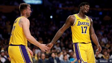 LOS ANGELES, CALIFORNIA - APRIL 11: Luka Doncic #77 and Dorian Finney-Smith #17 of the Los Angeles Lakers celebrate a basket during the second quarter against the Houston Rockets at Crypto.com Arena on April 11, 2025 in Los Angeles, California. NOTE TO USER: User expressly acknowledges and agrees that, by downloading and or using this photograph, User is consenting to the terms and conditions of the Getty Images License Agreement. Katelyn Mulcahy/Getty Images/AFP (Photo by Katelyn Mulcahy / GETTY IMAGES NORTH AMERICA / Getty Images via AFP)