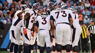 CHARLOTTE, NORTH CAROLINA - NOVEMBER 27: Russell Wilson #3 of the Denver Broncos calls a play in the huddle during the first half against the Carolina Panthers at Bank of America Stadium on November 27, 2022 in Charlotte, North Carolina. Grant Halverson/Getty Images/AFP (Photo by GRANT HALVERSON / GETTY IMAGES NORTH AMERICA / Getty Images via AFP)