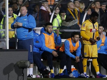 Britain Football Soccer - Sutton United v Arsenal - FA Cup Fifth Round - The Borough Sports Ground - 20/2/17 Sutton United&#039;s substitute Wayne Shaw eats a pie during the match Action Images via Reuters / Andrew Couldridge Livepic EDITORIAL USE ONLY. No use with unauthorized audio, video, data, fixture lists, club/league logos or &quot;live&quot; services. Online in-match use limited to 45 images, no video emulation. No use in betting, games or single club/league/player publications.  Please contact your account representative for further details.