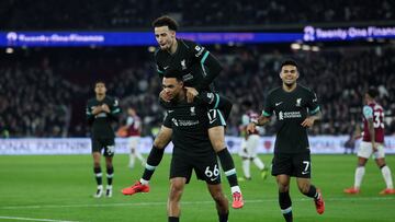 Soccer Football - Premier League - West Ham United v Liverpool - London Stadium, London, Britain - December 29, 2024 Liverpool's Trent Alexander-Arnold celebrates scoring their fourth goal with Curtis Jones and Luis Diaz REUTERS/Isabel Infantes EDITORIAL USE ONLY. NO USE WITH UNAUTHORIZED AUDIO, VIDEO, DATA, FIXTURE LISTS, CLUB/LEAGUE LOGOS OR 'LIVE' SERVICES. ONLINE IN-MATCH USE LIMITED TO 120 IMAGES, NO VIDEO EMULATION. NO USE IN BETTING, GAMES OR SINGLE CLUB/LEAGUE/PLAYER PUBLICATIONS. PLEASE CONTACT YOUR ACCOUNT REPRESENTATIVE FOR FURTHER DETAILS..