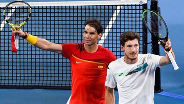 Rafael Nadal (L) and Pablo Carreno Busta (R) of Spain celebrate winning their men&#039;s double match against Sander Gille and Joran Vliegen of Belgium at the ATP Cup tennis tournament in Sydney on January 10, 2020. (Photo by William WEST / AFP) / --IMAGE RESTRICTED TO EDITORIAL USE - NO COMMERCIAL USE--