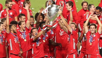 YEARENDER SPORT
(FILES) In this file photo taken on August 23, 2020 Bayern Munich players celebrate with the trophy after the UEFA Champions League final football match between Paris Saint-Germain and Bayern Munich at the Luz stadium in Lisbon on Augus