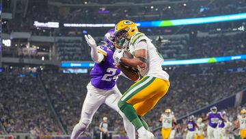 Dec 31, 2023; Minneapolis, Minnesota, USA; Green Bay Packers wide receiver Bo Melton (80) catches a pass for a touchdown against the Minnesota Vikings in the third quarter at U.S. Bank Stadium. Mandatory Credit: Brad Rempel-USA TODAY Sports