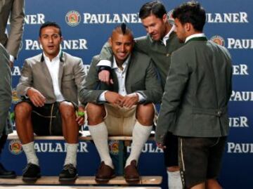 Bayern Munich's Thiago, Arturo Vidal, Xabi Alonso, and Juan Bernat (L-R), wearing traditional attire, attend a photocall for a sponsor in Munich, Germany September 14, 2016. REUTERS/Michaela Rehle