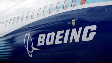 FILE PHOTO: The Boeing logo is seen on the side of a Boeing 737 MAX at the Farnborough International Airshow, in Farnborough, Britain, July 20, 2022.  REUTERS/Peter Cziborra/File Photo