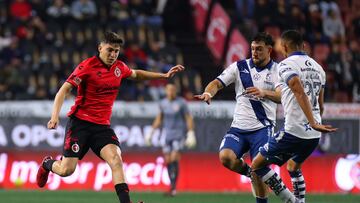 Rafael Fernandez of Tijuana and Lucas Cavallini of Puebla during the 16th round match between Tijuana and Puebla as part of the Torneo Clausura 2024 Liga BBVA MX at Caliente Stadium on April 19, 2024 in Tijuana, Baja California, Mexico.