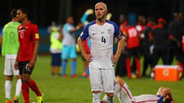 COUVA, TRINIDAD AND TOBAGO - OCTOBER 10: A contrast of emotions as captain Michael Bradley (C) of the United States mens national team reacts as Trinidad and Tobago pull of a win during the FIFA World Cup Qualifier match between Trinidad and Tobago at the Ato Boldon Stadium on October 10, 2017 in Couva, Trinidad And Tobago.   Ashley Allen/Getty Images/AFP
 == FOR NEWSPAPERS, INTERNET, TELCOS &amp; TELEVISION USE ONLY ==