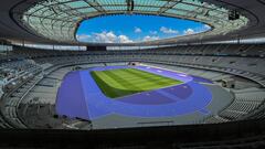 (FILES) This photograph shows a general view of the new track of the Stade de France, the Olympic Stadium of the Paris 2024 Olympic and Paralympic Games, in Saint-Denis, North of Paris, on May 7, 2024. The 2024 Paris Olympic Games are set to begin with an unprecedented open-air ceremony on the river Seine on July 26, 2024, as most concerns so far relate to security arrangements for the opening festivities. (Photo by Martin BUREAU / AFP)