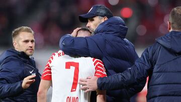 Leipzig's Spanish forward #07 Dani Olmo is comforted by Leipzig's German head coach Marco Rose after an injury during the German first division Bundesliga football match between RB Leipzig and FC Cologne in Leipzig, eastern Germany on October 28, 2023. (Photo by Ronny HARTMANN / AFP) / DFL REGULATIONS PROHIBIT ANY USE OF PHOTOGRAPHS AS IMAGE SEQUENCES AND/OR QUASI-VIDEO