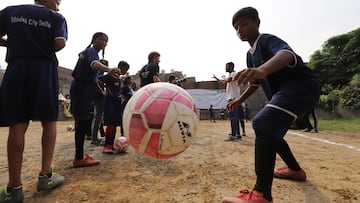 NEW DELHI, INDIA - SEPTEMBER 17: boy play football during a Laureus IWC programme visit on September 17, 2022 in New Delhi, India. (Photo by Surjeet Yadav/Getty Images for Laureus)