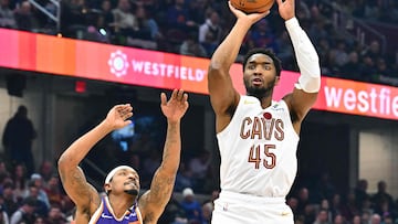 Donovan Mitchell #45 of the Cleveland Cavaliers shoots over Bradley Beal #3 of the Phoenix Suns during the second quarter at Rocket Mortgage Fieldhouse on January 20, 2025 in Cleveland, Ohio.