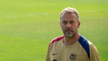 Barcelona's German coach Hansi Flick attends his first training session as Barcelona's new head coach at the Joan Gamper training ground in Sant Joan Despi, near Barcelona, on July 19, 2024. Former German coach of Bayern Munich Hansi Flick was appointed on May 29, 2024, as new Barcelona's coach on a deal which runs till June 2026, after sacking Xavi Hernandez. (Photo by Manaure QUINTERO / AFP)