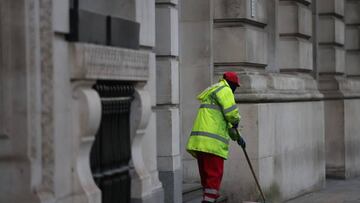 A street cleaner sweeps in the City of London, London, UK, on Tuesday, Feb. 14, 2023. UK wages rose quicker than expected at the end of 2022, heaping pressure on the Bank of England to deliver another interest-rate increase next month. Photographer: Hollie Adams/Bloomberg via Getty Images