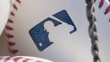 (FILES) In this file photo taken on June 27, 2018 a baseball with MLB logo is seen at Citizens Bank Park before a game between the Washington Nationals and Philadelphia Phillies in Philadelphia, Pennsylvania. - Nine players and four staffers tested positi