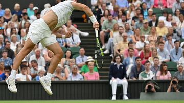 Spain's Carlos Alcaraz serves to Chile's Nicolas Jarry during their men's singles tennis match on the sixth day of the 2023 Wimbledon Championships at The All England Tennis Club in Wimbledon, southwest London, on July 8, 2023. (Photo by Glyn KIRK / AFP) / RESTRICTED TO EDITORIAL USE