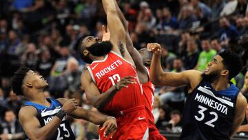 MINNEAPOLIS, MN - APRIL 23: James Harden #13 of the Houston Rockets tips the ball against Jimmy Butler #23 and Karl-Anthony Towns #32 of the Minnesota Timberwolves during the fourth quarter in Game Four of Round One of the 2018 NBA Playoffs on April 23, 2018 at the Target Center in Minneapolis, Minnesota. The Rockets defeated the Timberwolves 119-100. NOTE TO USER: User expressly acknowledges and agrees that, by downloading and or using this Photograph, user is consenting to the terms and conditions of the Getty Images License Agreement. Hannah Foslien/Getty Images/AFP
== FOR NEWSPAPERS, INTERNET, TELCOS & TELEVISION USE ONLY ==