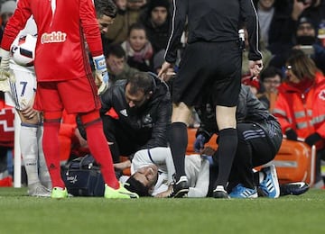 Asensio receives treatment after clashing with Roncaglia.