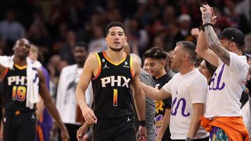 PHOENIX, ARIZONA - DECEMBER 17: Devin Booker #1 of the Phoenix Suns reacts after defeating the New Orleans Pelicans in the NBA game at Footprint Center on December 17, 2022 in Phoenix, Arizona. The Suns defeated the Pelicans 118-114. NOTE TO USER: User expressly acknowledges and agrees that, by downloading and or using this photograph, User is consenting to the terms and conditions of the Getty Images License Agreement. Christian Petersen/Getty Images/AFP (Photo by Christian Petersen / GETTY IMAGES NORTH AMERICA / Getty Images via AFP)