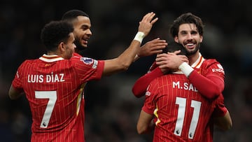 LONDON, ENGLAND - DECEMBER 22: Mohamed Salah of Liverpool celebrates scoring his team's fifth goal with teammates Dominik Szoboszlai, Cody Gakpo and Luis Diaz during the Premier League match between Tottenham Hotspur FC and Liverpool FC at Tottenham Hotspur Stadium on December 22, 2024 in London, England. (Photo by Alex Pantling/Getty Images)