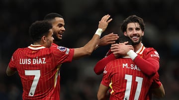 LONDON, ENGLAND - DECEMBER 22: Mohamed Salah of Liverpool celebrates scoring his team's fifth goal with teammates Dominik Szoboszlai, Cody Gakpo and Luis Diaz during the Premier League match between Tottenham Hotspur FC and Liverpool FC at Tottenham Hotspur Stadium on December 22, 2024 in London, England. (Photo by Alex Pantling/Getty Images)
