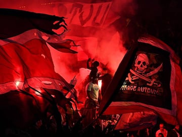 Paris Saint-Germain's supporters cheer with flags and flares during the French L1 football match between Paris Saint-Germain (PSG) and Nice (OGC Nice) on October 27, 2017, at the Parc des Princes stadium in Paris.