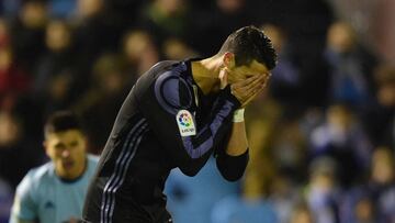 Real Madrid's Portuguese forward Cristiano Ronaldo gestures during the Spanish Copa del Rey (King's Cup) quarter final second leg football match RC Celta de Vigo vs Real Madrid CF RC Celta de Vigo on January 25, 2017.
A fine free-kick from Cristiano Ronaldo couldn't prevent Real Madrid from being dumped out of the Copa del Rey as a 2-2 draw at Celta Vigo today allowed the hosts to progress to the semi-finals 4-3 on aggregate. / AFP PHOTO / MIGUEL RIOPA