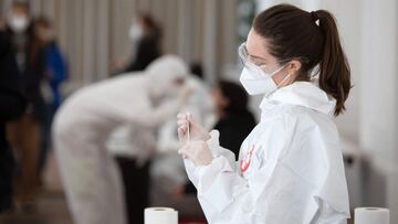 A health worker prepares a coronavirus antigen rapid test at the new coronavirus test center in the Orangery of the Schoenbrunn Palace on February 4, 2021 as Vienna expands its capacities for the rapid antigen test, amid the ongoing Covid-19 pandemic. (Ph